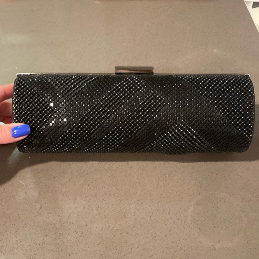 Bcbg black sequined oval clutch. Has chain straps that can be hidden inside.
